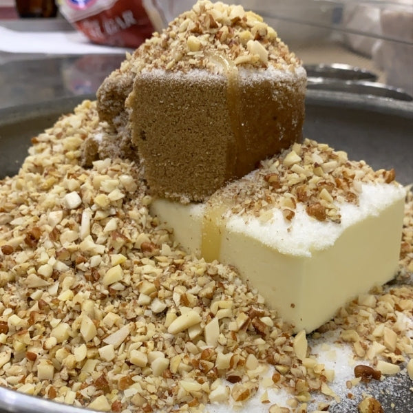 Fresh ingredients (butter, brown sugar, nuts) ready to be transformed into butter crunch in the frypan