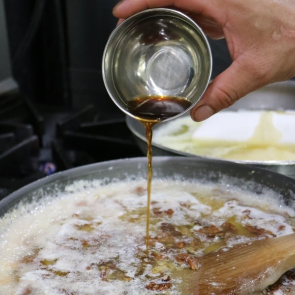 Each batch of butter crunch is handmade at every step, pouring into the pan